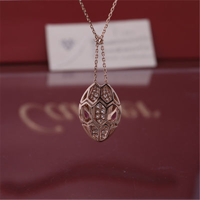 Kwaliteit Roman Serpenti-halsband in kt 18 nam goud met rubelliteogen en met diamanten pavé op het hoofd wordt geplaatst dat toe fabriek